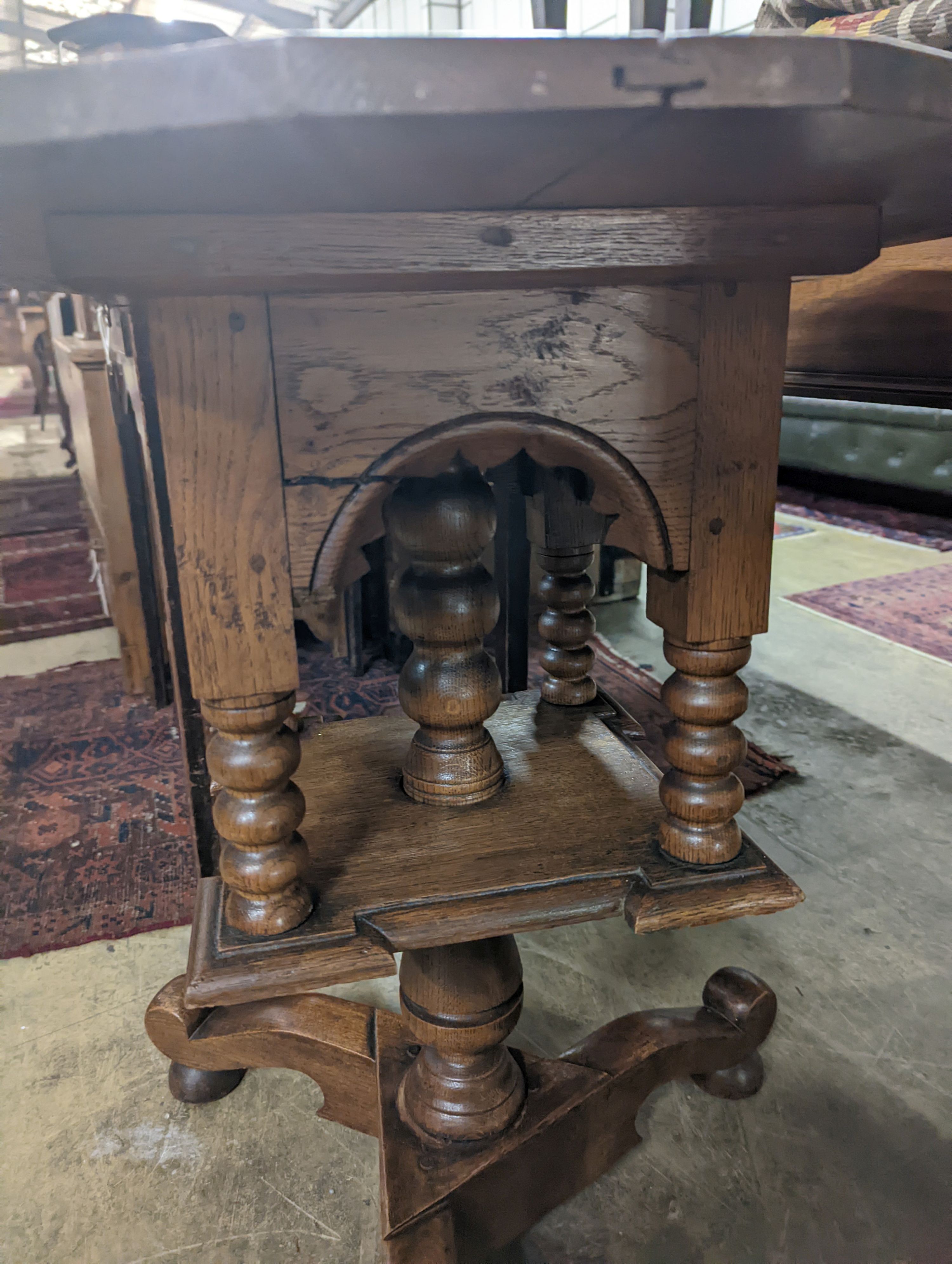 An early 20th century circular oak tripod book table, diameter 60cm, height 69cm